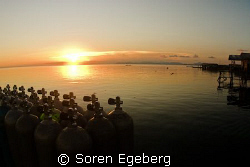 Sunset in Mabul homestay. by Soren Egeberg 